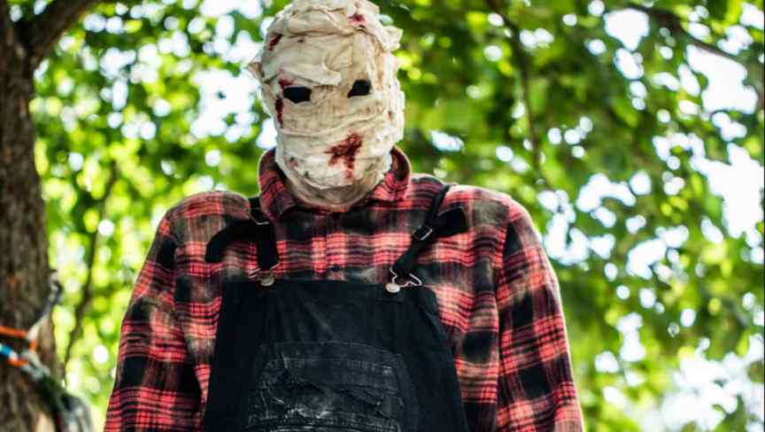 Bruce, the murderous handyman being controlled by the killer on The CW's Killer Camp