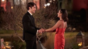 Katie Thurston and Greg holding hands.