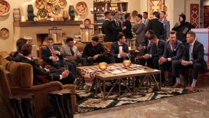 Katie Thurston's suitors sitting in a living room.
