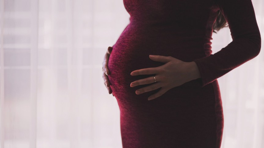 A pregnant woman.