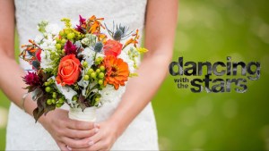 A bride holding flowers.
