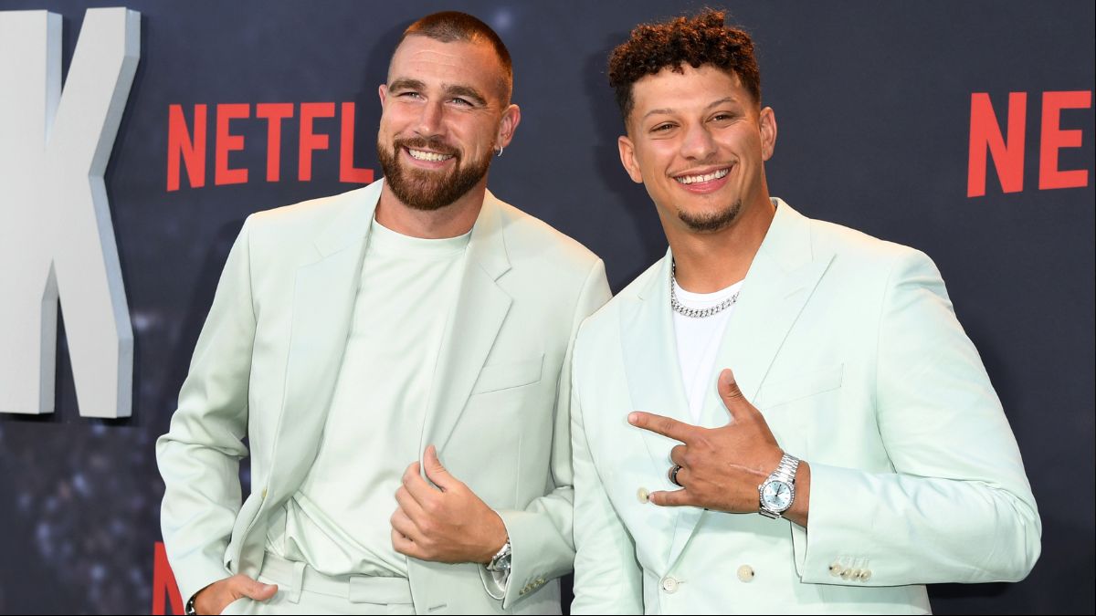 Travis Kelce and Patrick Mahomes pose on the red carpet at the Netflix premiere of Quarterback.