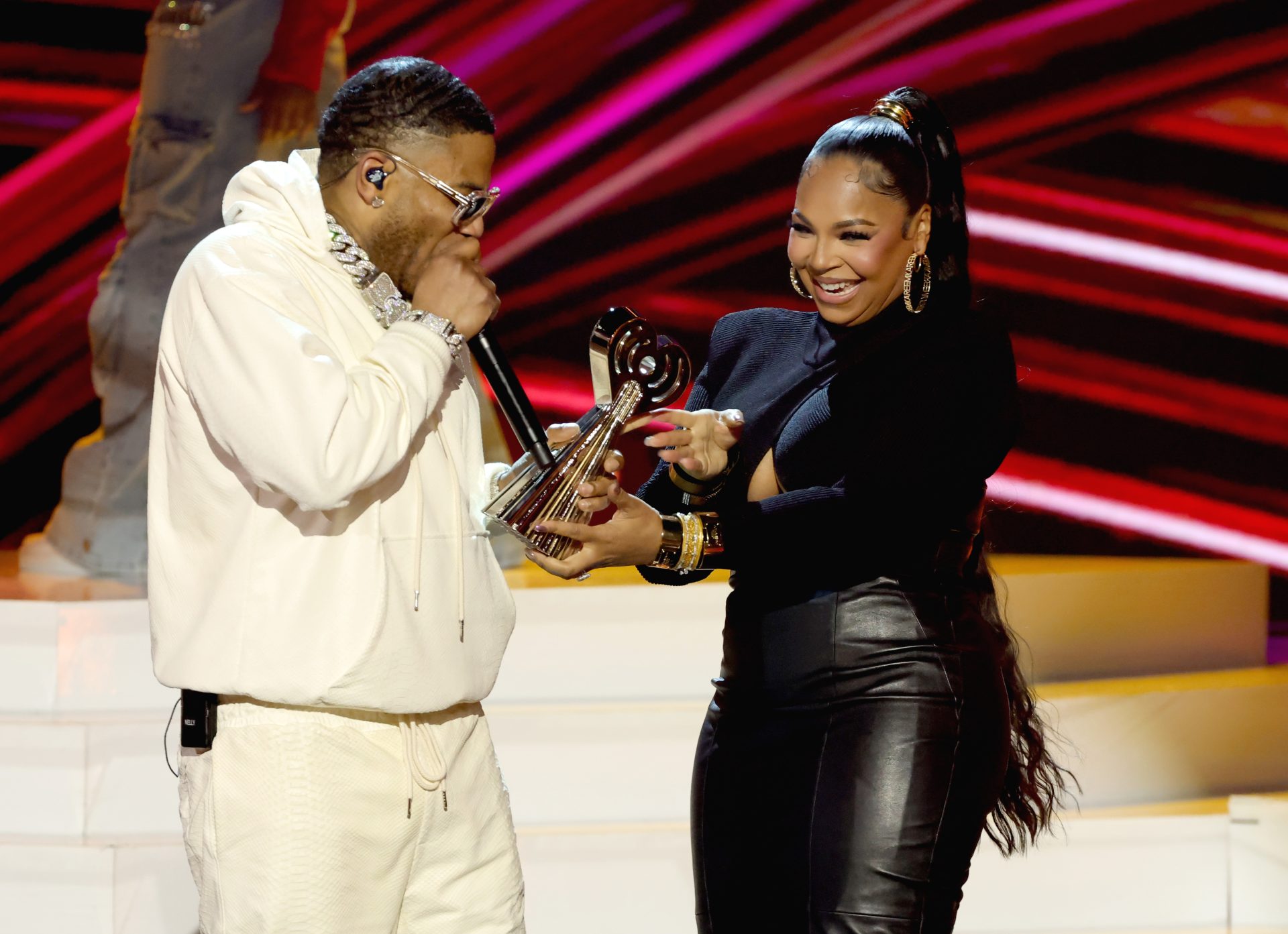 Nelly accepts the Landmark Award from Ashanti onstage at the 2025 iHeartRadio Music Awards a on March 17, 2025.