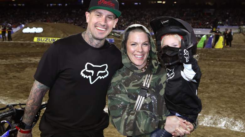 Carey Hart and Pink smiling with their child