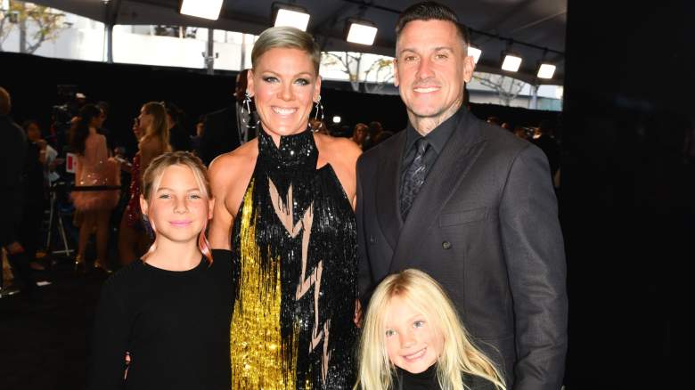 Carey Hart and Pink smiling with their children