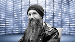 Cody Jinks smiles in a chair