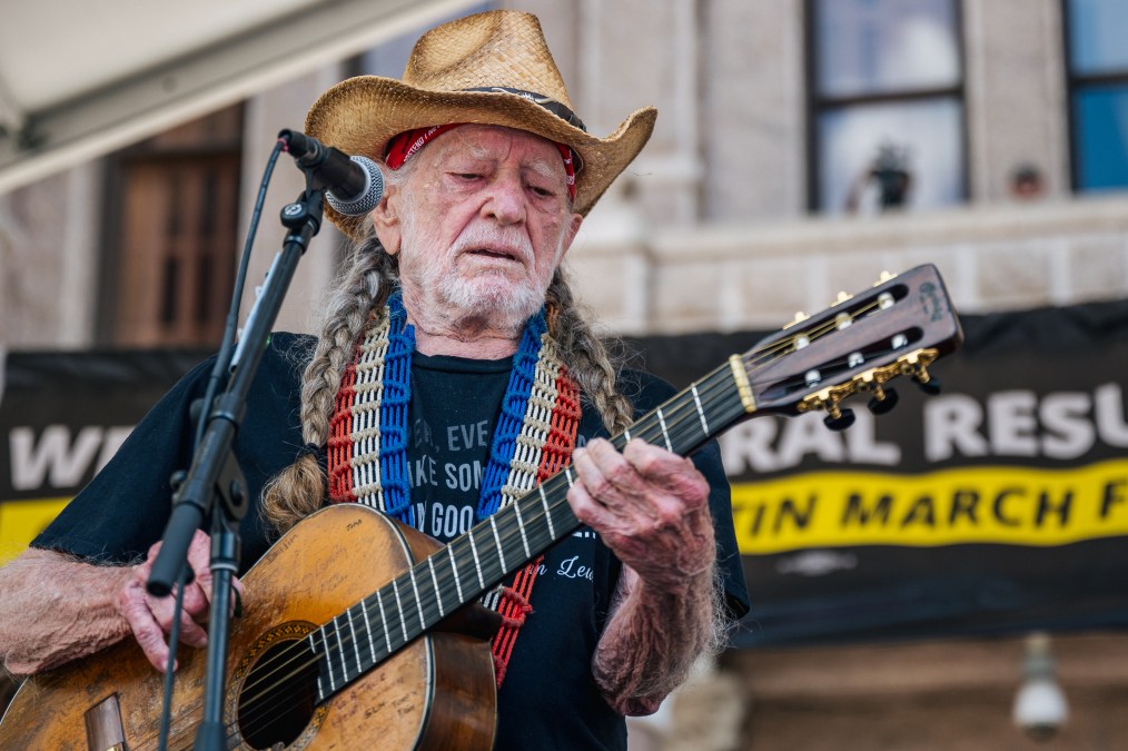 Willie Nelson playing guitar