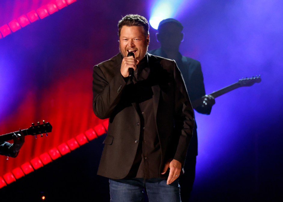 Blake Shelton singing into a microphone