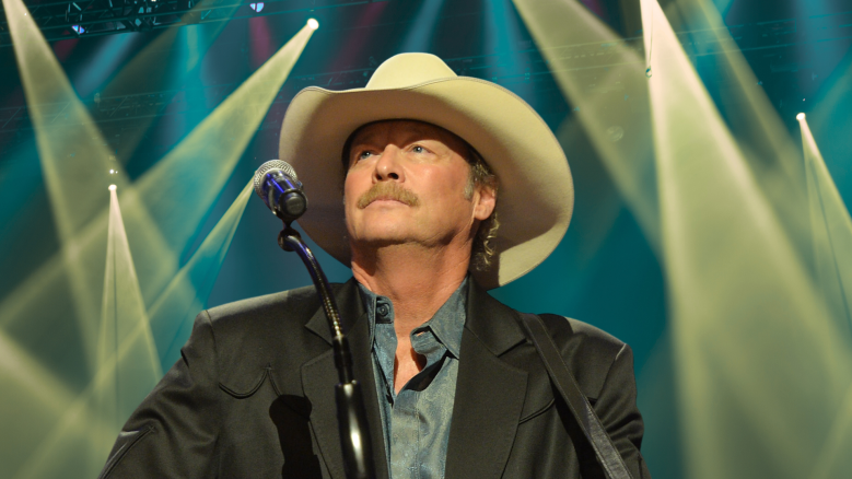 Alan Jackson looking up behind a microphone