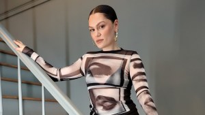 Jessie J poses for a photo on stairs