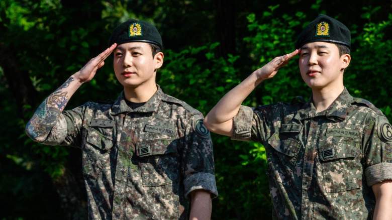 Jungkook and Jimin of K-pop supergroup BTS salute at an outdoor sporting facility in Yeoncheon on June 11, 2025