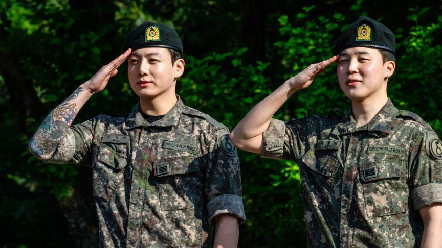 Jungkook and Jimin of K-pop supergroup BTS salute at an outdoor sporting facility in Yeoncheon on June 11, 2025