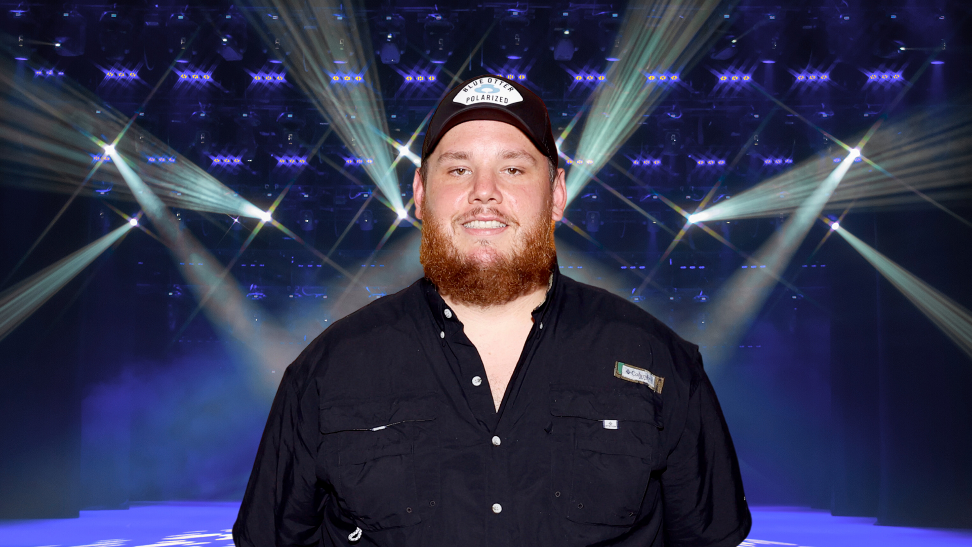 Luke Combs posing on stage