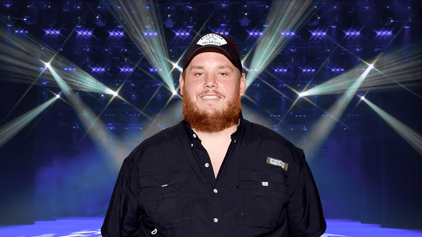 Luke Combs posing on stage