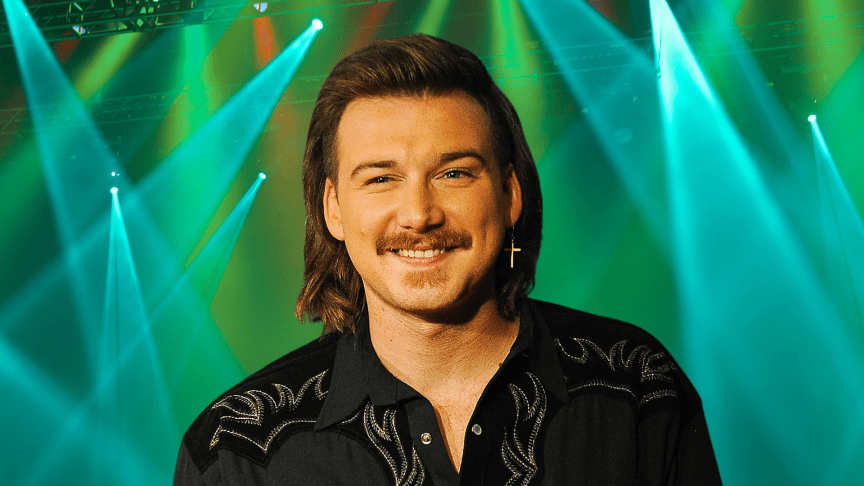 Morgan Wallen smiling with an earring