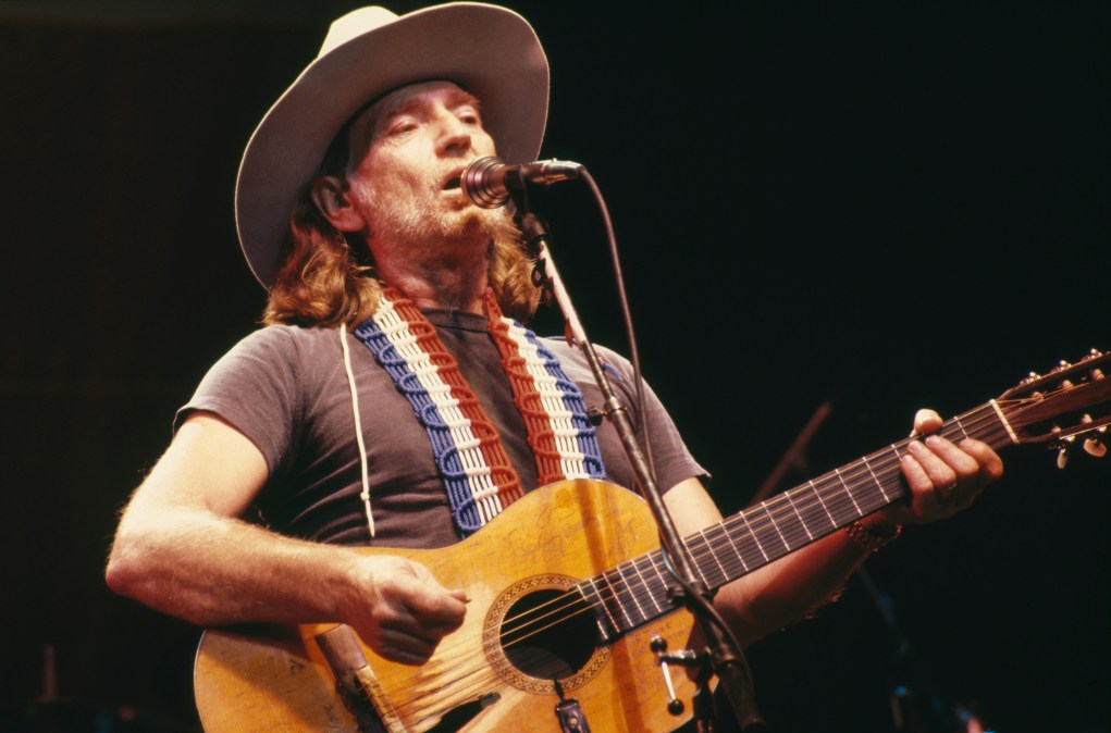 Willie Nelson playing guitar