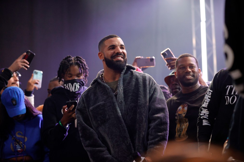 Drake smiling in a crowd
