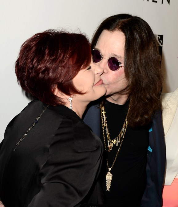 Ozzy Osbourne smooches Sharon Osbourne on the cheek at "An Evening With Women" Charity Event in 2013