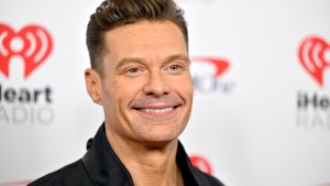 Ryan Seacrest posing for a photo
