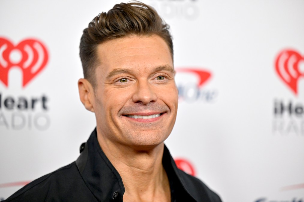 Ryan Seacrest posing for a photo