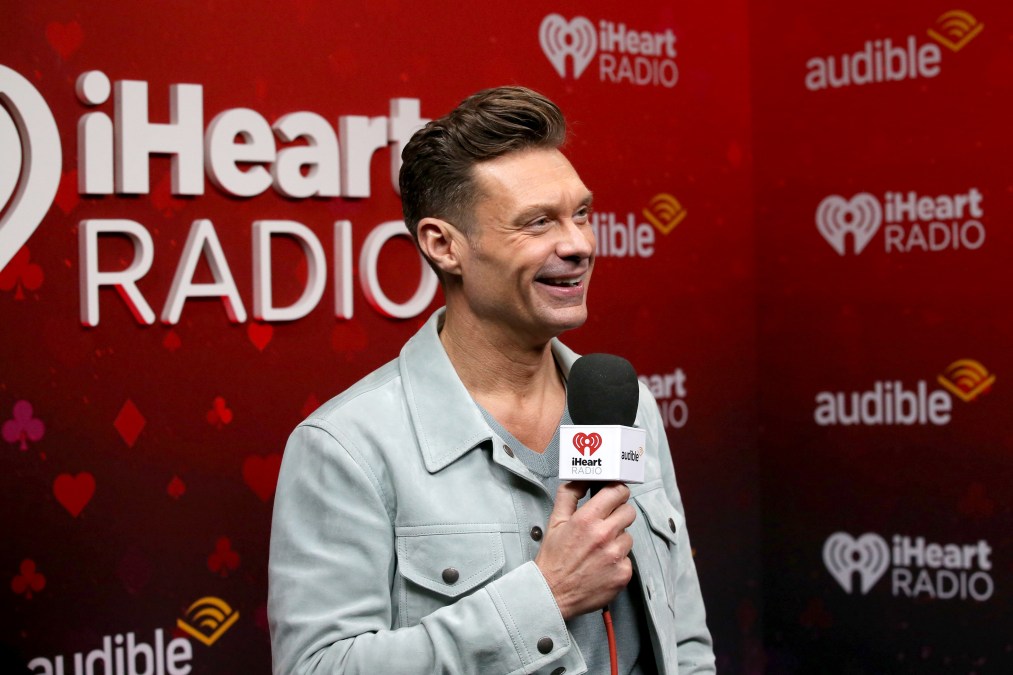 Ryan Seacrest holding a microphone