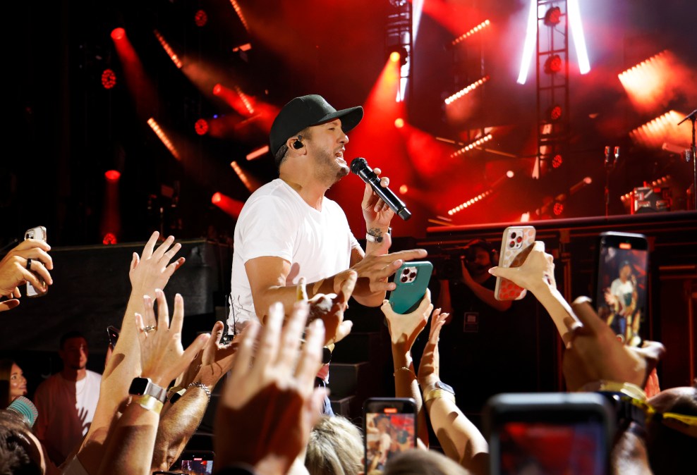 Luke Bryan singing for a crowd