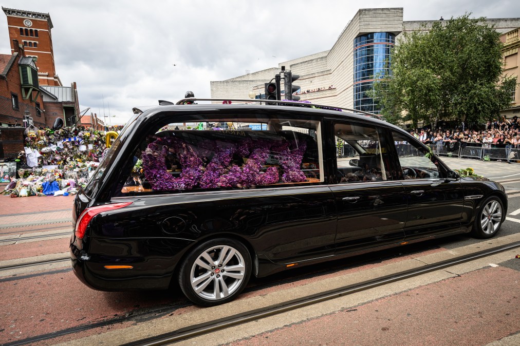 A hearse carrying the late Ozzy Osbourne arrives at Black Sabbath Bridge