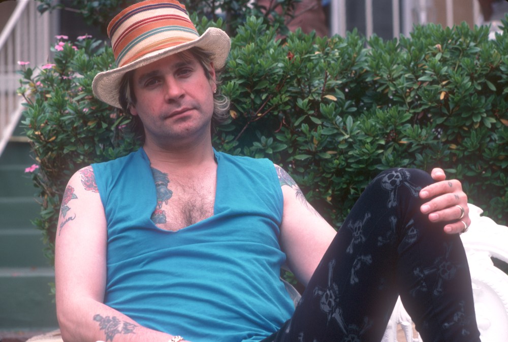 Ozzy Osbourne posing in a hat