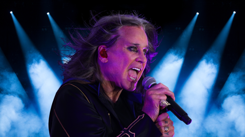 Ozzy Osbourne singing on stage.