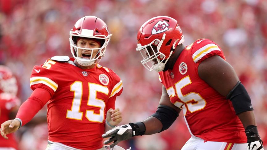Patrick Mahomes #15 of the Kansas City Chiefs celebrates with Trey Smith #65 after throwing a touchdown pass during the fourth quarter at Arrowhead Stadium on September 12, 2021 in Kansas City, Missouri