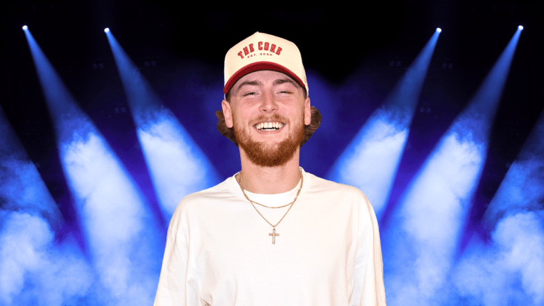 Bailey Zimmerman smiles in a white hat and t-shirt.