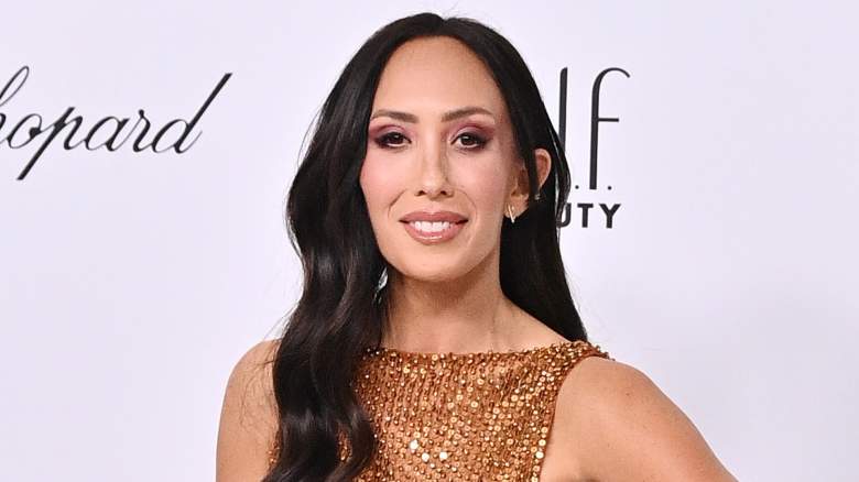 Cheryl Burke smiling at an event