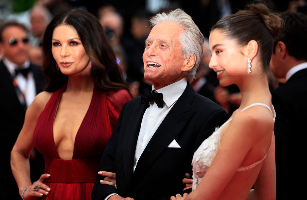 Michael Douglas (C) arrives with his wife British actress Catherine Zeta-Jones (L) and daughter Carys