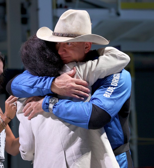 Jeff Bezos hugs his mother, Jacklyn Bezos