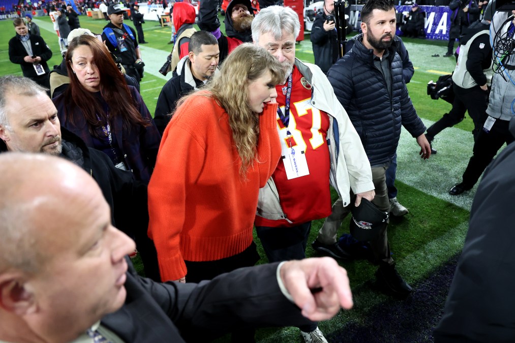 Taylor Swift is seen on the field with Ed Kelce, father of Travis Kelce