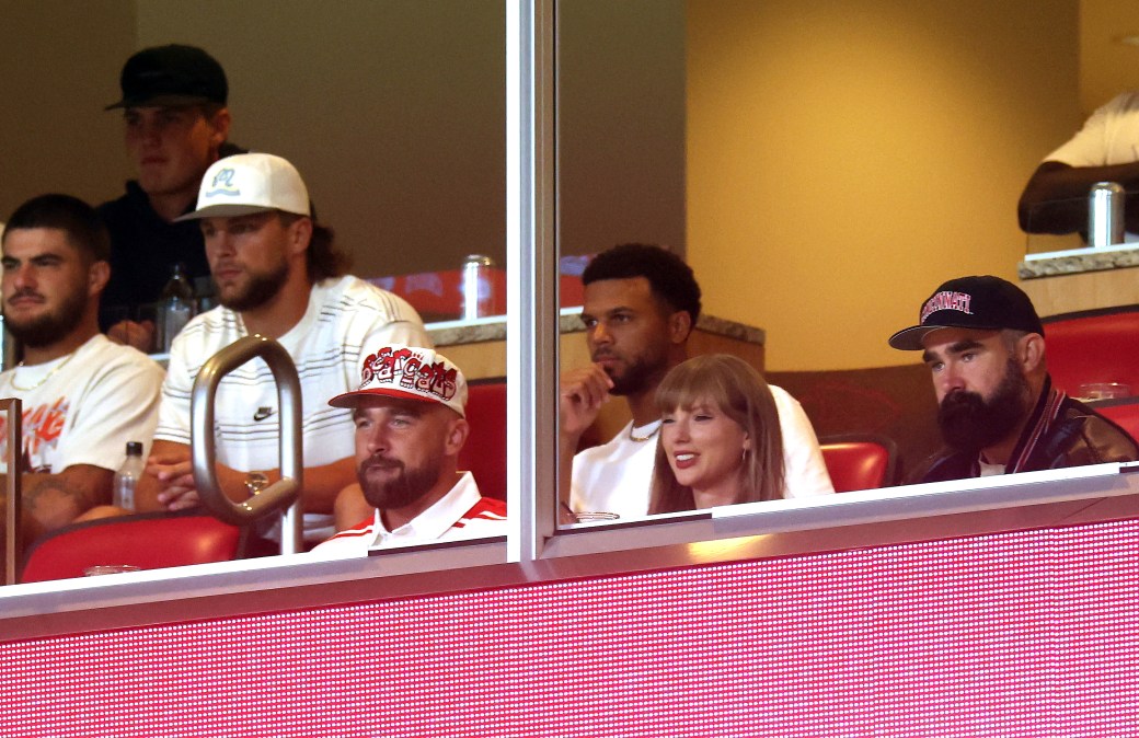 Travis Kelce #87 of the Kansas City Chiefs, Taylor Swift and Jason Kelce