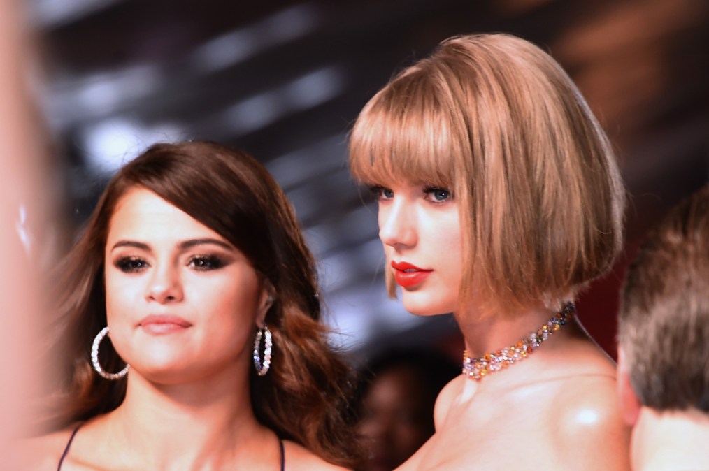 Musicians Selena Gomez (L) and Taylor Swift