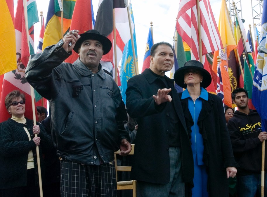  Former heavyweight boxing champion Muhammad Ali (C) acknowledges the crowd with his brother Rahaman Ali (L) and wife Lonnie Ali (R) during the dedication of the Muhammad Ali Center November 20, 2005 in Louisville, Kentucky.