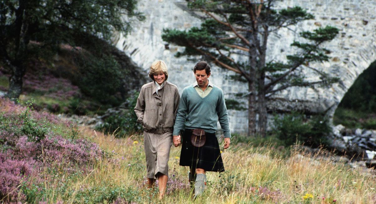 The Prince and Princess of Wales take a walk by the River Dee on the Balmoral estate during their honeymoon in Scotland, September 1981