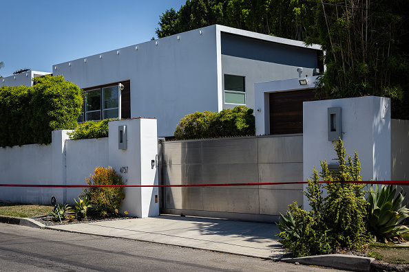 Los Angeles Police Department officials secure the home where Robin Kaye an "American Idol" music supervisor and her husband Thomas Deluca were found killed 