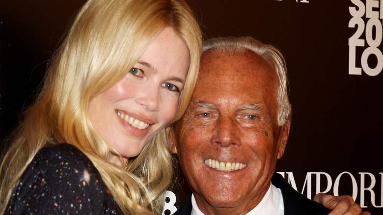 Claudia Schiffer and Giorgio Armani smiling and posing for photos