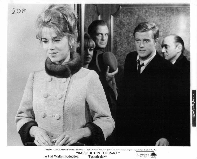 Jane Fonda standing before Robert Redford in a scene from the film 'Barefoot In The Park', 1967.