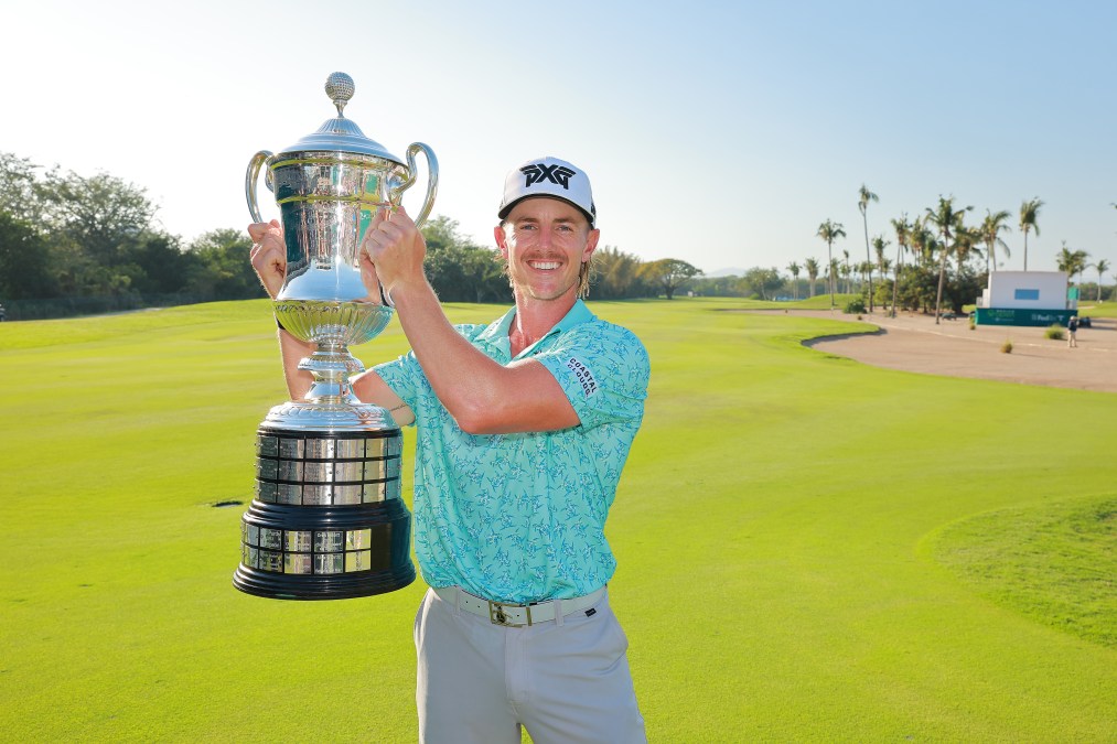 Jake Knapp of the United States poses with the champions trophy