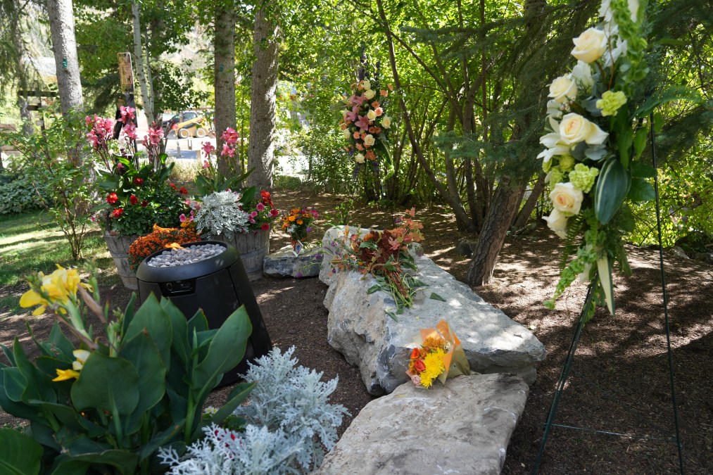 Flowers are left on a makeshift memorial at the Sundance Resort
