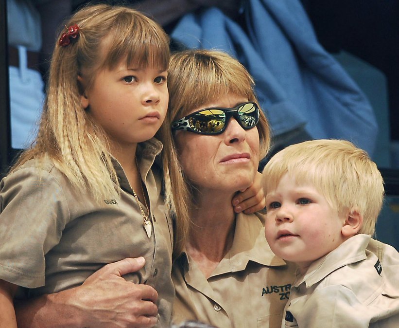 Terri Irwin (C), wife of Australian environmentalist and television personality Steve Irwin holds her daughter Bindi (L) and son Bob 