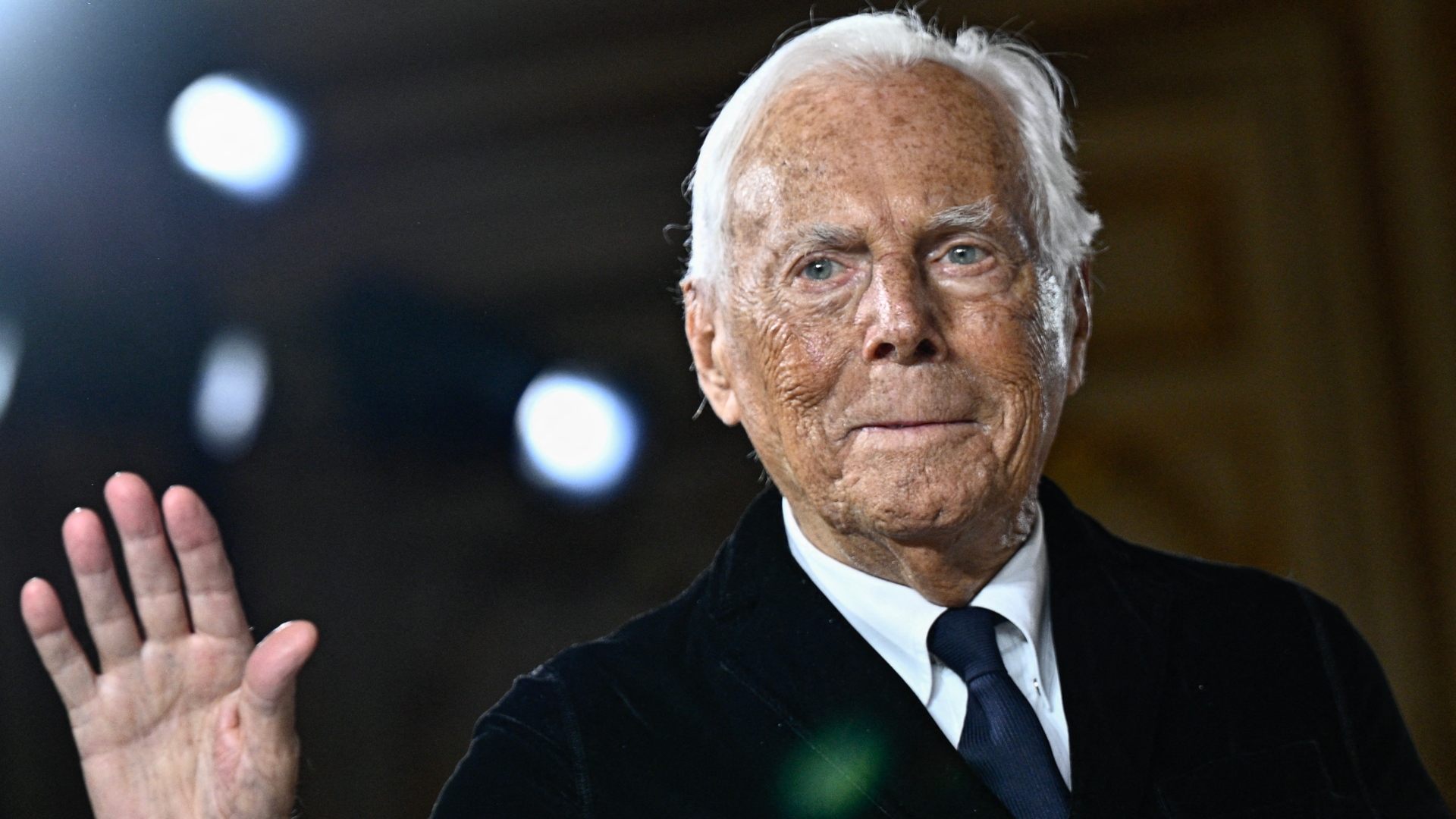 Giorgio Armani waving