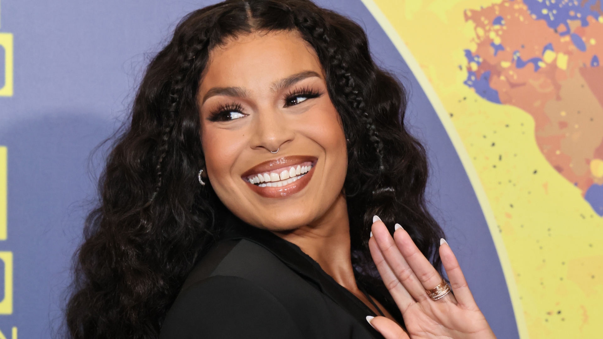 Jordin Sparks smiling and waving
