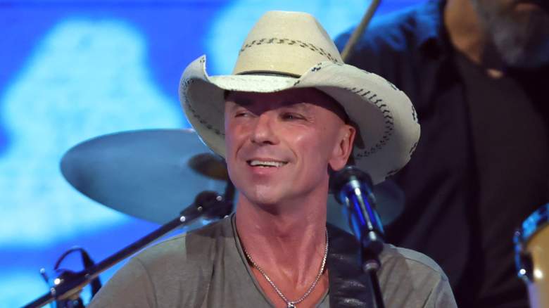 Kenny Chesney smiling and performing
