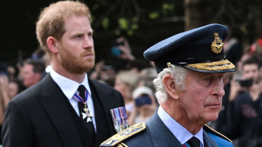 Britain's King Charles III and Britain's Prince Harry, Duke of Sussex walk behind the coffin of Queen Elizabeth II,