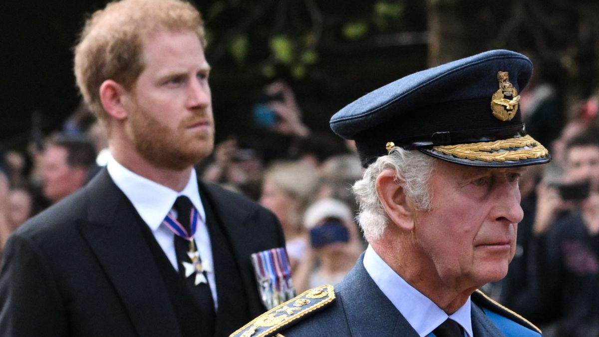 Britain's King Charles III and Britain's Prince Harry, Duke of Sussex walk behind the coffin of Queen Elizabeth II,